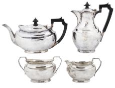 An Edwardian four piece silver tea set, hallmarked Sheffield 1928/1929/1931,