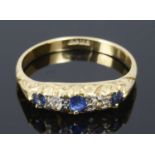 A sapphire and diamond set five stone ring