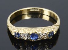 A sapphire and diamond set five stone ring