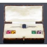 An unusual Art Deco silver and interchangeable coloured paste 'gem' brooch in original fitted case,