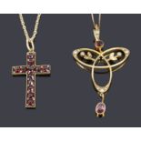 An Art Nouveau garnet and seed pearl scroll pendant and a Victorian garnet set cross