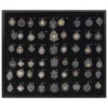 A collection of fifty four silver medals, dating from the early 20th century