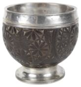 A George III silver mounted coconut cup
