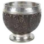 A George III silver mounted coconut cup