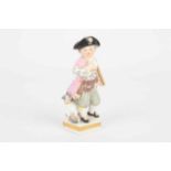 A 19th century Meissen porcelain figure of a young boy