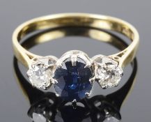 A Continental three stone sapphire and diamond set ring