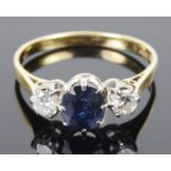 A Continental three stone sapphire and diamond set ring