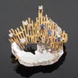 A Continental modernist 18ct gold sapphire and diamond set brooch