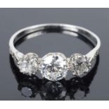An attractive Edwardian three stone diamond set ring,