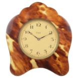 A faux tortoiseshell travelling clock