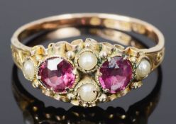 A delicate early Victorian garnet set and seed pearl ring