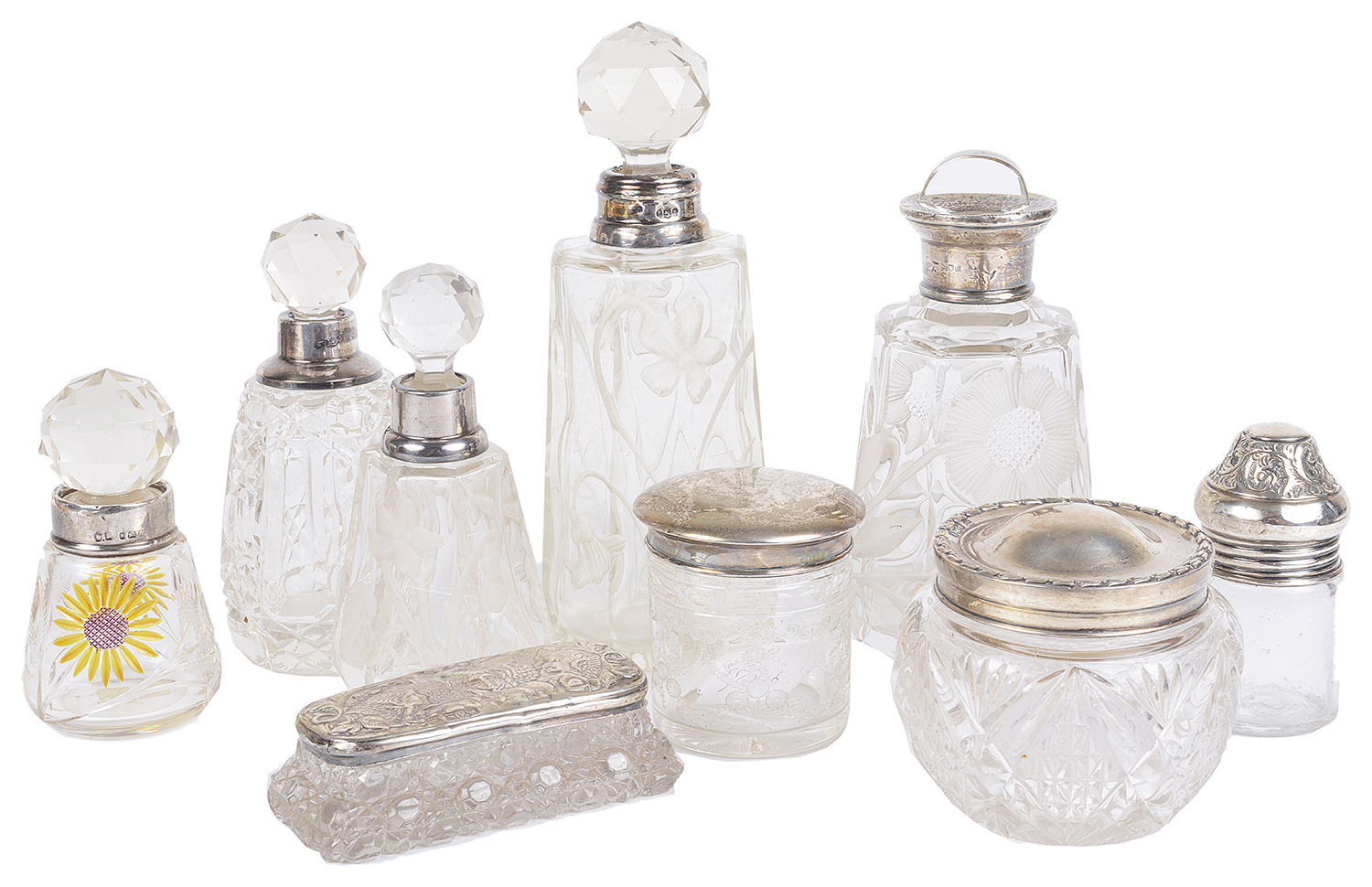 An assorted collection of silver and glass perfume bottles