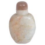 A 19th century Chinese pale green and russet jade snuff bottle