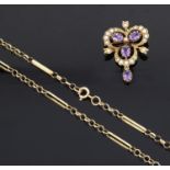 An attractive Edwardian style amethyst and seed pearl pendant brooch on fancy chain