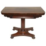 A Victorian mahogany fold over card table