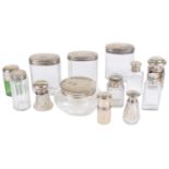 A collection of silver topped glass dressing table and vanity case jars and bottles