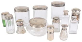 A collection of silver topped glass dressing table and vanity case jars and bottles