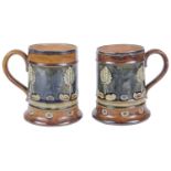A pair of Royal Doulton stoneware silver rimmed tankards