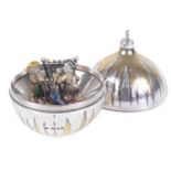 A parcel gilt, enamel and silver Stuart Devlin surprise Christmas bauble