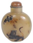 An amusing 19th century Chinese carved agate snuff bottle