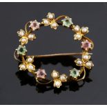 A delicate Edwardian pink and green gem and seed pearl set brooch