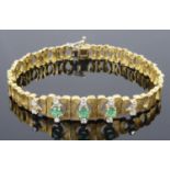 An attractive Continental emerald and diamond set articulated bracelet