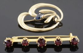 An Edwardian five stone garnet set bar brooch