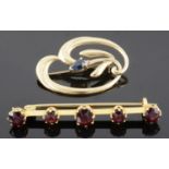 An Edwardian five stone garnet set bar brooch