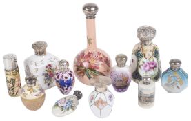 A collection of early 20th century and later silver mounted ceramic scent bottles