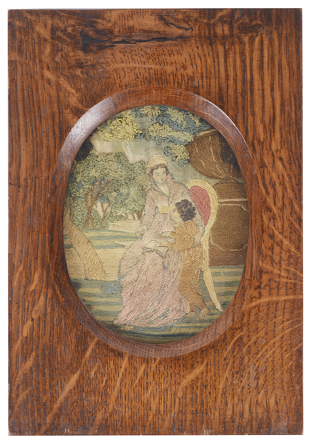 A small early 19th century silk needlework picture of a mother and child