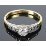 A delicate single stone diamond set ring