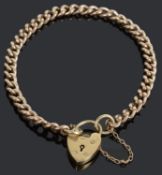 A 9ct gold curb link bracelet with heart locket