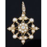 An attractive Victorian pearl and diamond set stylised floral circular pendant brooch