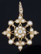 An attractive Victorian pearl and diamond set stylised floral circular pendant brooch