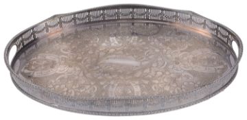 A silver-plated twin handled oval tray