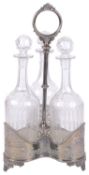 A silver plated decanter holder, with three cut glass decanters, early 20th century