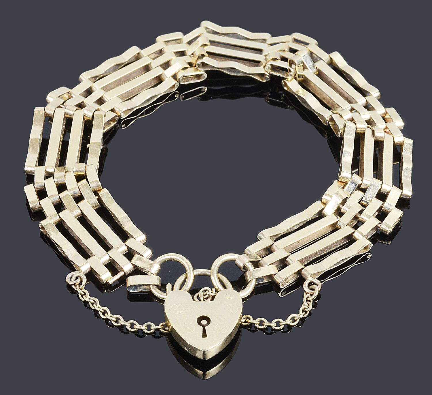 A 9ct gold four bar gate bracelet