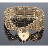 A fancy 9ct gold seven bar gate bracelet