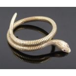 An attractive Victorian style coiled gold snake bracelet