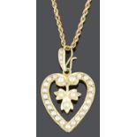 A charming late Victorian 15ct gold and seed pearl heart shaped pendant