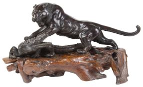 A good late 19th c. Japanese Meiji period bronze sculpture of a tiger attacking an alligator