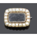 A small Georgian hair set half pearl mounted memorial brooch