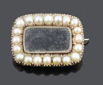 A small Georgian hair set half pearl mounted memorial brooch