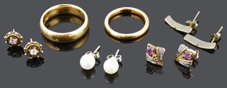 Two gold wedding bands together with a pair of Victorian diamond ear studs