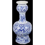 A Dutch Delft blue and white garlic necked octagonal bottle vase