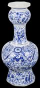 A Dutch Delft blue and white garlic necked octagonal bottle vase