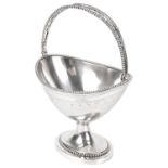 A Dutch neo-classical silver swing handled sugar basket, Amsterdam 1851, with makers mark W.V