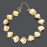 A continental cultured pearl set scallop shell bracelet