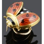 A charming 18ct gold and enamel ladybird pin by Berndt Munsteiner
