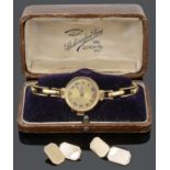 A 18ct gold ladies wristwatch and a set of 9ct gold cufflinks